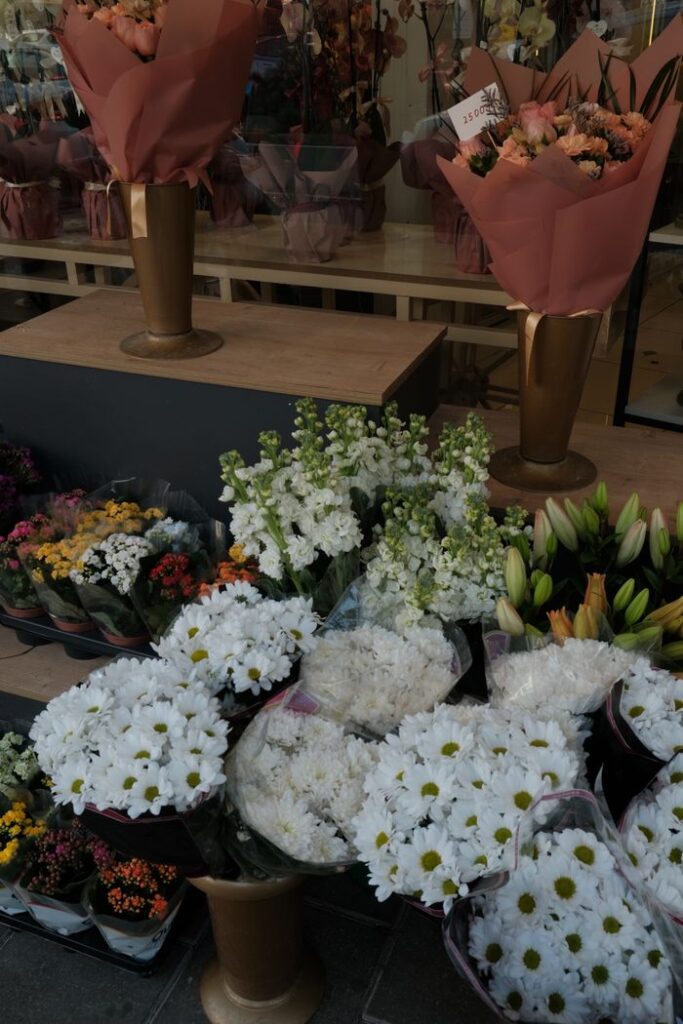 Colorful assortment of flowers at a florist's display, perfect for brightening any space.