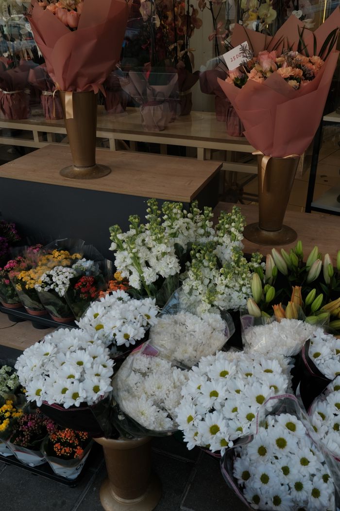 Colorful assortment of flowers at a florist's display, perfect for brightening any space.
